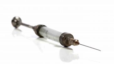 man injects himself with his semen